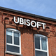 The façade of the Ubisoft Montreal offices featuring the company logo against a brick wall.